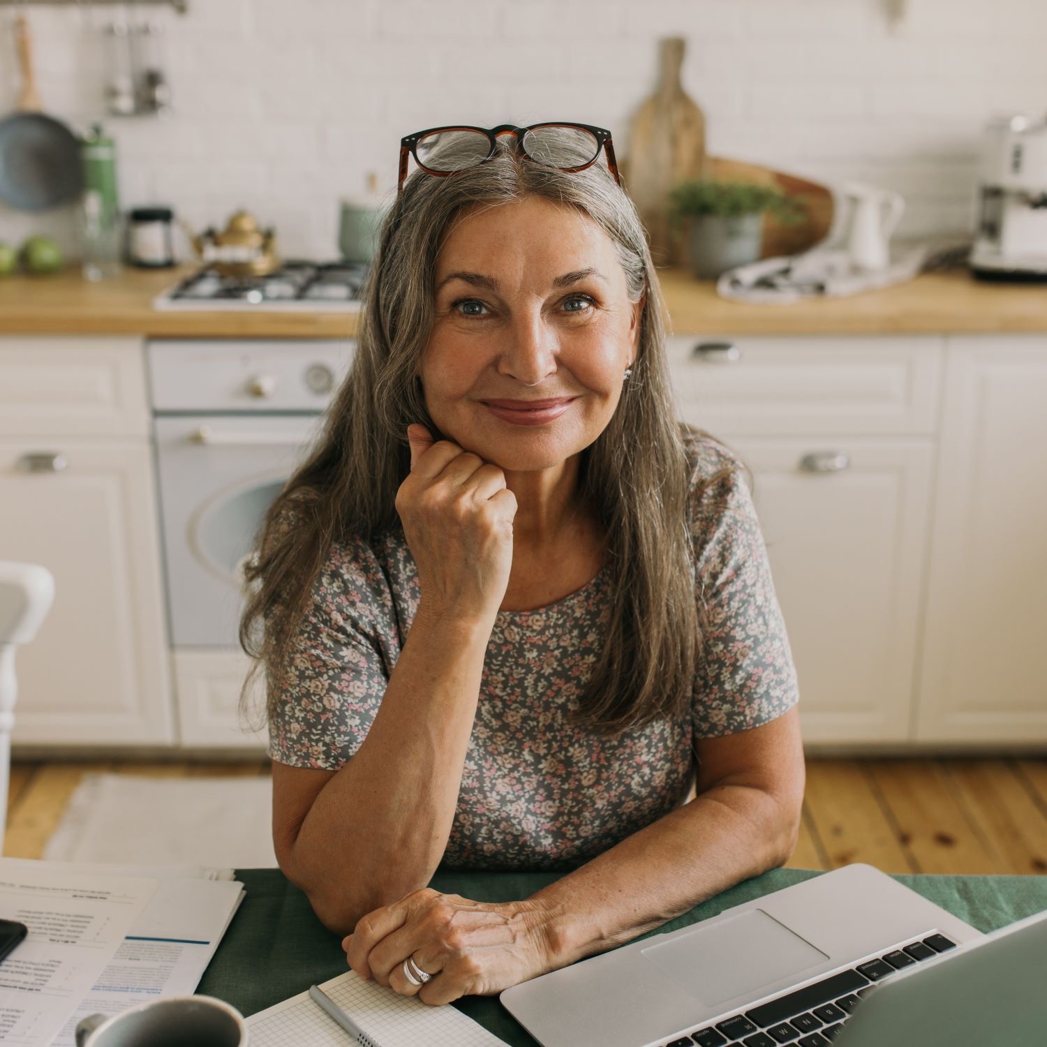Adult working at home with laptop